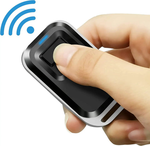 Close-up of a hand holding a remote from the 2.4GHz WiFi Remote Access Control System With 600Lb Magnetic Door Lock Kit for easy use.