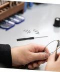 Person using Eyeglass Repair Kit With Precision Screwdriver Set Sunglass Screws Replacement Nose Pad Cushions Tweezers And Storage Case