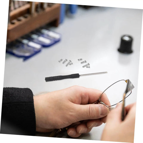 Person using Eyeglass Repair Kit With Precision Screwdriver Set Sunglass Screws Replacement Nose Pad Cushions Tweezers And Storage Case