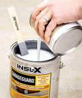 Pouring catalyzed epoxy into 1-gallon can of Catalyzed Epoxy Garage Floor Paint Kit, Waterbased Semi Gloss Finish, Showroom Gray.