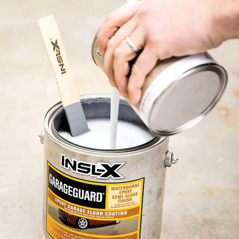 Pouring catalyzed epoxy into 1-gallon can of Catalyzed Epoxy Garage Floor Paint Kit, Waterbased Semi Gloss Finish, Showroom Gray.