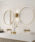 Stylish Modern 2 Light Vanity Light Fixture In Matte Gold With Clear Glass Up And Down Wall Sconces For Bathroom Bedroom Hallway And Kitchen Bulbs Not Included mounted on bathroom wall between two mirrors