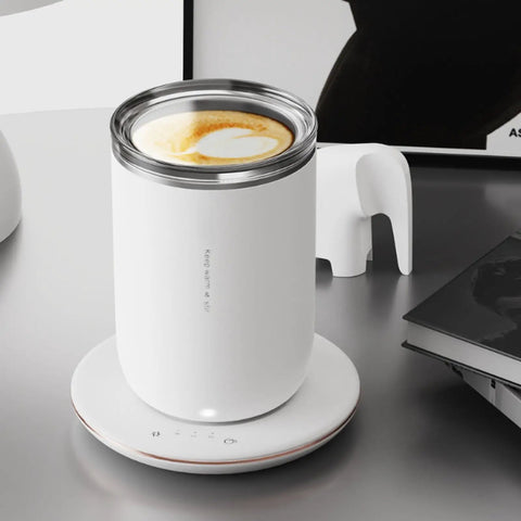 Slick 2 In 1 Self Stirring Heated Coffee Mug With Automatic Mixing And 3 Chill Proof Temp Modes For Coffee Milk Cocoa Protein Shakes 300 Ml Stainless Steel on a white heating base.