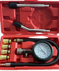 Engine compression tester kit with gauge (0-300 PSI), hoses and brass adapters in red plastic case