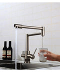 GAZOGJ Faucet, Brass Brushed Kitchen Folding Faucet with Pure Water Cold Hot Kitchen Modern Drinking Water 3 Way Filtered Faucet Mixer,Brushed with Hose-D pouring water into a glass.