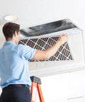 Person installing Pleated Replacement Air Filter for AC and Furnace 21.5 by 23.5 Inches Pack of 4 MERV 8 Pollen and Dust Control