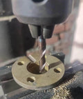 2-flute carbide end mill installed in a milling machine cutting a round metal flange; square-nose, center-cut, upcut
