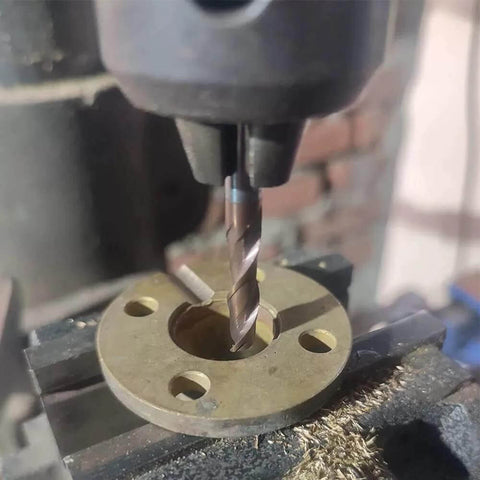 2-flute carbide end mill installed in a milling machine cutting a round metal flange; square-nose, center-cut, upcut