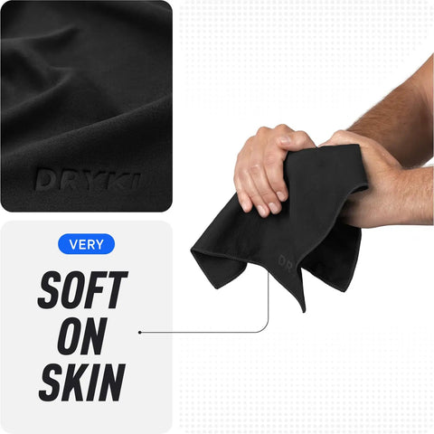 Close-up of black Pocket Sized Sweat Towels For Face Hands And Body On The Go Quick Dry Microfiber Handkerchiefs being held, showing softness.