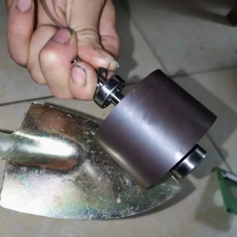 Hand holding part of 1000W Micro Hydroelectric Generator Power Station For Home Lighting And Outdoor Adventures 220V Hydropower Turbine With Copper Core Coil Workhorse Aluminum Shell Built For Off Grid Living.