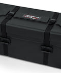 Premium Rotomolded Drum Set Case With Carpet Lined Interior And Removable Tray For Hardware Storage, black with latches and wheels.