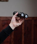 Four Chamber Shaker With Silky Smooth Tone, Effortless To Play And Consistent Rhythm For Any Skill Level, Studio And Stage Ready, Co Designed With Grammy Winning Percussionist Luis Conte, Not Made In China, Durable Build For Everyday Jams, black 4-chamber shaker in hand