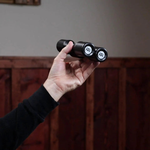 Four Chamber Shaker With Silky Smooth Tone, Effortless To Play And Consistent Rhythm For Any Skill Level, Studio And Stage Ready, Co Designed With Grammy Winning Percussionist Luis Conte, Not Made In China, Durable Build For Everyday Jams, black 4-chamber shaker in hand