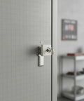 Heavy Duty Zinc Alloy Cam Lock For Cabinets And Drawers installed on a cabinet with key inserted, beige finish, sturdy rotating mechanism.