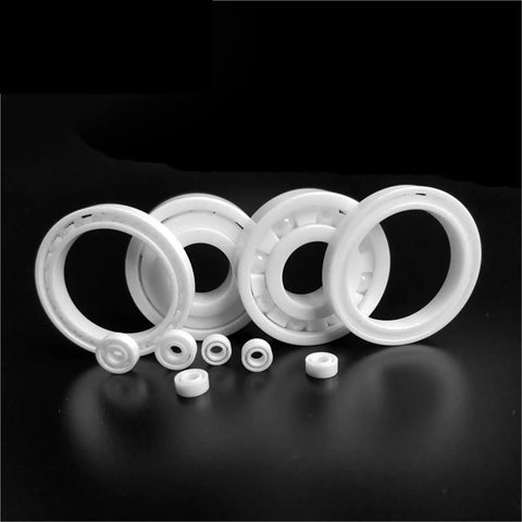 Top Tier 10 Pack Hybrid Ceramic Ball Bearings 695x5x13mm for Boat Vessel Fishing Rods showing white ceramic bearings on a dark background.