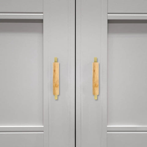 Sleek Dope Solid Wood Cabinet Pull Handle Set For Cabinets, 96mm Aluminum Wood Bar Pull With Gold Finish, mounted on gray doors