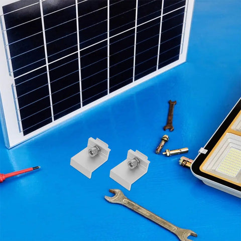 Rock Solid Heavy Duty Aluminum Solar Panel Clamps 12 Piece Set with M8x25 Hex Screws on a blue workbench.