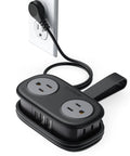 Compact Travel Power Strip With Four AC Outlets And A Four Foot Wrap Around Cord connected to a wall socket, with multiple ports.