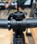 Close-up of 35mm Handlebar Bike Stem Mount For Garmin Edge Wahoo ELEMNT Bryton, black aluminum, front view on bike handlebars.