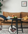 Living room with Four Pack 2x2 Square Rubber Furniture Caster Cups Non Slip Bed Frame Stoppers Floor Protectors under sofa legs.