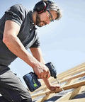 Man using Kickass Cordless Impact Drill And Driver With Brushless EC-TEC Motor 18V System to fasten wood beams.