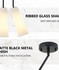 Ziikopoo 2 Pack Modern Matte Black Kitchen Island Pendant Lights, conical ribbed glass shades with soft diffused light overhead.