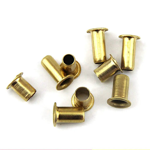 Copper Hollow Rivets Kit For Circuit Boards M0.9 M1.3 M1.5 M1.7 Mixed Sizes For PCB Nails Grommet Tool on white surface