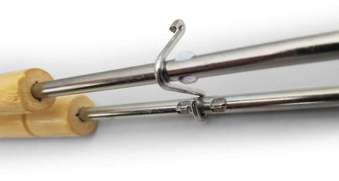 Close-up of handles for Cast Iron Double Camp Cooker Set With Two Cooking Surfaces Preseasoned For Instant Use Perfect For Camping Grillin