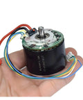 Cool 12V Brushless Motor With Big Neodymium Mag For Industrial Or DIY Work held in hand, showcasing wires and compact design.