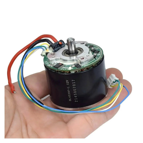 Cool 12V Brushless Motor With Big Neodymium Mag For Industrial Or DIY Work held in hand, showcasing wires and compact design.
