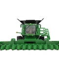 Front view of One Sixty Fourth Scale S7 900 Combine With Interchangeable CF12 Folding Corn Head Farm Show Edition model for collectors.
