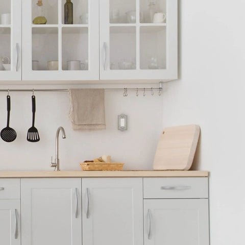 Kitchen with Meadows Light Switch Cover Plate In Greek Revival Style With Decorative Border And Curved Edges near countertop.