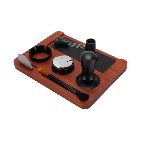 Solid Wood Espresso Tamper Station With Silicone Mat And Seven Piece Barista Gear featuring black accessories and wood base for home brewing.