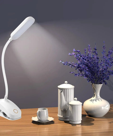 Clip On Desk Lamp With Flexible Gooseneck 7W 2600mAh Battery Operated Rechargeable Reading Light next to teapot on table