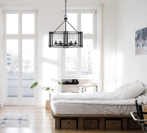 Luton Cage Metal Chandelier with Clear Cylinder Glass Shades Six Light Uplights in bedroom setting.