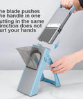 Blue mandoline slicer with detachable blades and clear feed chute, front view