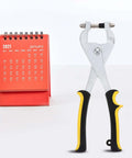 Leather Hole Punch Pliers Handheld Punch Tool For Crafting And Leathercraft with anti-slip handle beside a red calendar