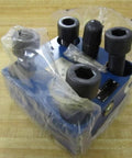 Hydraulic manifold single unit R900974682 FD 69213 LFA 63 DBW2-71/400 in clear packaging with visible port connections.