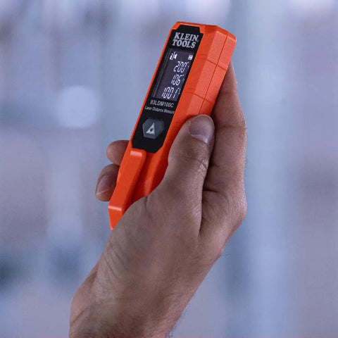 Person using Super Handy Laser Distance Measure That Runs From 2 Inches To 100 Feet With Sharp Precision Reads Feet Inches And Meters Backlit LCD