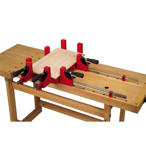 24 Inch Woodworking Parallel Clamp That Cranks Up 1000 Lbs Of Clamping Pressure, Boss Level 90 Degree Jaws in use on workbench