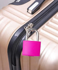 Pink mini luggage lock with keys on beige suitcase, Six Pack Multicolor Mini Luggage Locks With Keys For Lockers And Suitcases