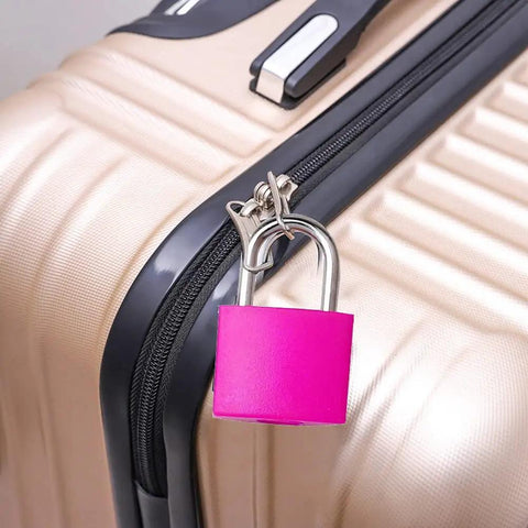 Pink mini luggage lock with keys on beige suitcase, Six Pack Multicolor Mini Luggage Locks With Keys For Lockers And Suitcases
