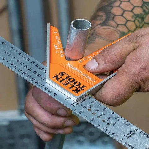 Person using 935CSEL Magnetic Combo Square Ruler for Electricians and Carpenters, aluminum double sided tool with bubble level.