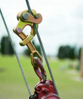 Haven's Grip Wire Pulling Tool For Wire Rope Up To 0.75 Inch, attached to red machinery in outdoor field