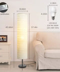 Modern Tall Floor Lamp With Dimmable Three-Level Brightness, Paper Lampshade beside a beige sofa in a living room.
