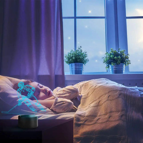 Hockey Player 3D Night Lamp With 7 LED Color Changing Lights illuminating a child's room with a blue 3D holographic effect.