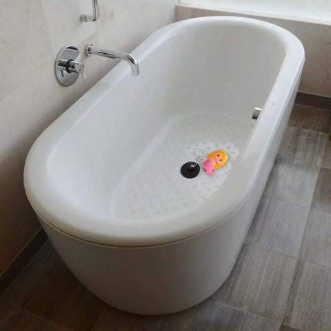 Mermaid Rubber Tub Stopper with Chain for Bathtub Drains in a white modern bathtub with a pink toy and drain.