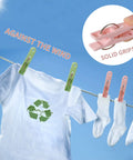 No Mess Plastic Clothes Pins 48 Pack Heavy Duty Workhorse Colored Laundry Clips on clothes line holding a t-shirt and socks.