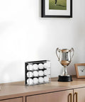 Wall Mount Acrylic Golf Ball Display Case With 3 Tiers Holds 12 Balls, Clear Showpiece Storage Box on wooden cabinet with trophy.