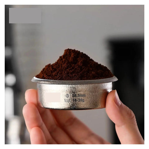 Dope Titanium Espresso Distributor And Ground Leveling Tool For Even Coffee Bed Prep In 58.5mm Portafilter Baskets with ground coffee.